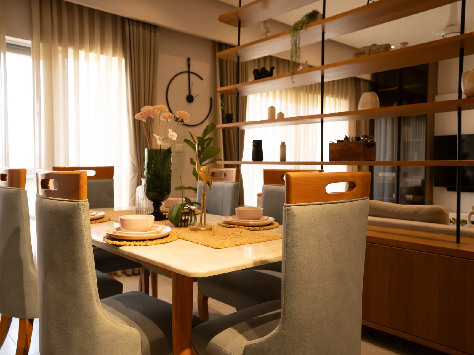 Dining table with high-back grey chairs — Amlan's Residence